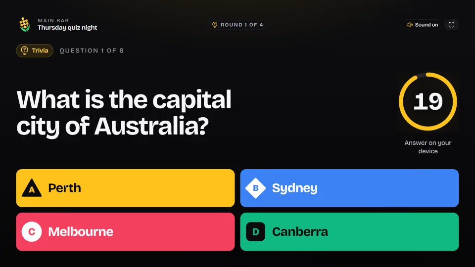 The big screen asking for the capital city of Australia, with four coloured answers and a countdown